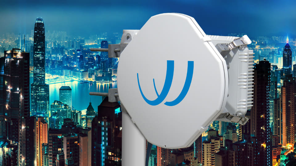 BridgeWave wireless radio device against city skyline, symbolizing wireless connectivity solutions from Winncom Technologies.